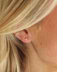 Model Wearing Daisy Studs - Token Jewelry - 14k gold fill stud earring - hypoallergenic - tiny flower earring -