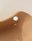 14k gold fill Mother of pearl ring on a tan plate