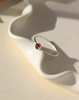 Sterling silver simple ring band with a 4mm red garnet stone