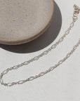925 Sterling silver Clara Bracelet laid on a white plate