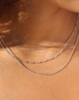 925 sterling silver Callie chain on model paired with the silver la mer chain