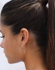 model wearing 14k gold fill medium horseshoes
