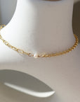 Emma bracelet set on top of a white pot. this bracelet features the narrow link chain, a tiny pearl gemstone, and the Dylan chain. The jewelry is handmade in Eau Claire Wisconsin, at Token Jewelry.