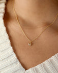 model wearing 14k gold fill dainty chain necklace with 14k gold fill puff heart charm