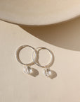 Faceted crystal hoop earrings in sterling silver — elegant, lightweight hoops with sparkling crystal accents.