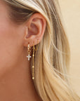 Faith Hoops — 14K gold fill mini hoop earrings with a delicate sparkling cross charm, lightweight and versatile for everyday wear