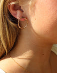 Form Studs in 14k gold fill worn by a model