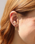 Model wearing a 14k gold fill textured rolo chain dropped from a classic ball stud