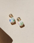 Floral ceramic cube charm with pastel vintage-inspired flowers and gold loop.