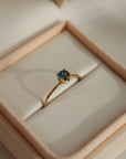 A timeless soft London blue topaz sits on a 14k gold solitaire band, December birthstone, soft blue hue, gift, handmade in eau claire, wisconsin, handmade jewelry, heirloom collection, everyday solid gold, solitaire ring, blue gemstone ring