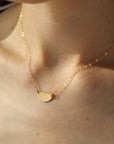 textured half-moon style necklace handmade by Token Jewelry in Eau Claire, Wisconsin