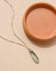 Laguna Pendant Necklace with faceted teardrop blue-green fluorite on petite sterling silver box chain, styled layered with other sparkly chains