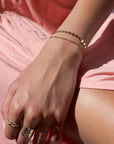 Model found wearing 14k gold fill Starlight Bracelet, also worn with multiple different rings plus an additional bracelet.