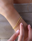 Model wearing 14k gold fill La mer Bracelet