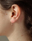 Model wearing 14k gold fill Mini Staples