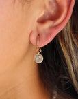 Model wearing 14k gold fill Starry Night Coin hoops