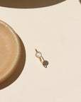 Close-up of stackable moonstone glow ring with iridescent shimmer in gold fill