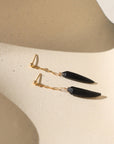Onyx Drops featuring matte claw-shaped onyx stones suspended from polished gold fill chain and ball posts