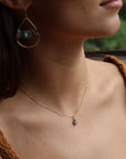 Minimal bezel-set labradorite pendant necklace on gold chain, handmade by Token Jewelry