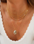 Sea Drift Necklace with unique terra agate gemstone pendant on delicate paperclip chain in gold fill, shown layered with other necklaces.