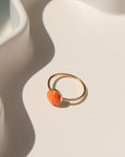 Sienna Ring featuring a vibrant spiny oyster gemstone on a hand-hammered sterling silver band.