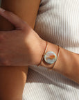 Model wearing the siren cuff. It features a Terra Agate Gemstone wire wrapped to a 14k gold fill wide cuff.