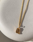 personalized gothic initial charm handmade by Token Jewelry in Eau Claire, Wisconsin