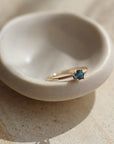 A timeless soft London blue topaz sits on a 14k gold solitaire band, December birthstone, soft blue hue, gift, handmade in eau claire, wisconsin, handmade jewelry, heirloom collection, everyday solid gold, solitaire ring, blue gemstone ring