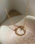 solid gold eternity necklace, smaller version of classic eternity, solid gold necklace, made in the USA, handmade in eau claire, wi, handmade jewelry, timeless jewelry, timeless designs, solid gold necklace, solid gold necklace, classic designs, timeless, elegant, everyday
