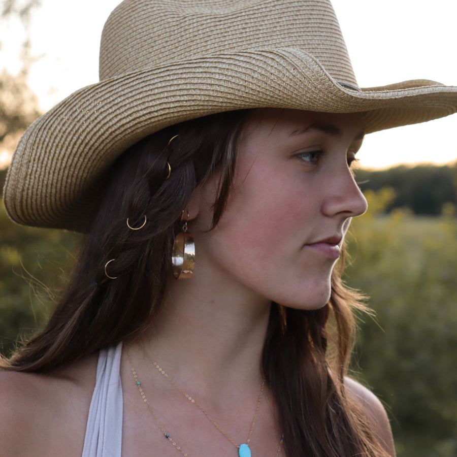 model wearing hammered hoops, thick shiny hammered hoops, 14k Gold Filled, Sterling Silver, Eau Claire Wi, Handmade