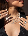 925 sterling silver chain with a toggle clasp and large pearl, photographed on a model wearing black and all silver jewelry