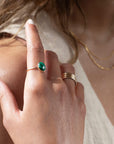 sterling silver ring with a green malachite stone, photographed on a model