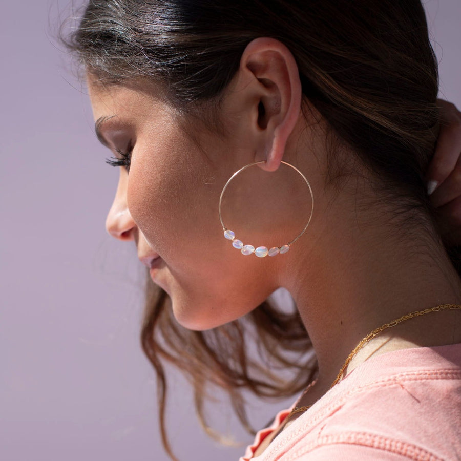 14k gold fill or sterling silver hoops, handmade and lightly hammered for shine, then adorned with six genuine australian opals that are delicately wire-wrapped.