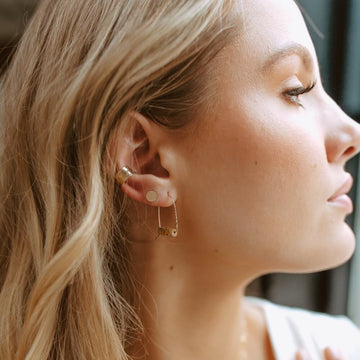 Hammered 14k gold filled ear cuff shown with 14 gold filled circle Studs and Leopard Skin Jasper Hoops on model - Handmade by Token Jewelry in Eau Claire, WI