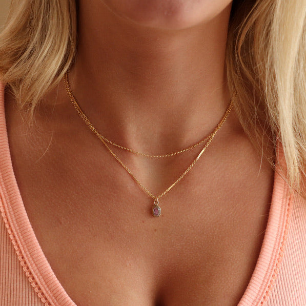 model wearing 14k gold fill chain necklace with abalone stone pendant paired 14k gold fill chain necklace