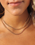 model wearing 14k gold fill curb chain necklaces