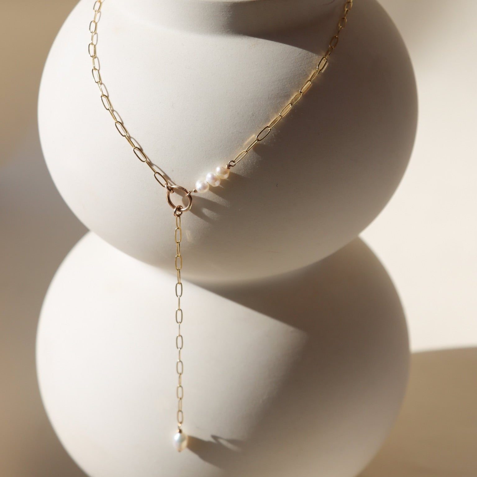 Elegant Ava Pearl Necklace crafted in 14K gold fill, showcasing timeless simplicity with a glowing freshwater pearl.