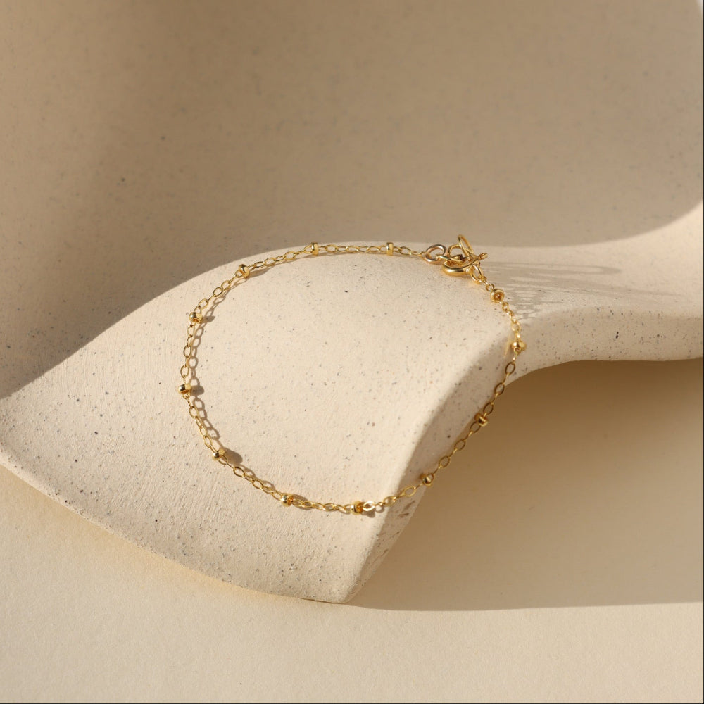 Beaded Bracelet with delicate textured beads that catch the light. Lightweight and timeless, perfect for layering or wearing alone.