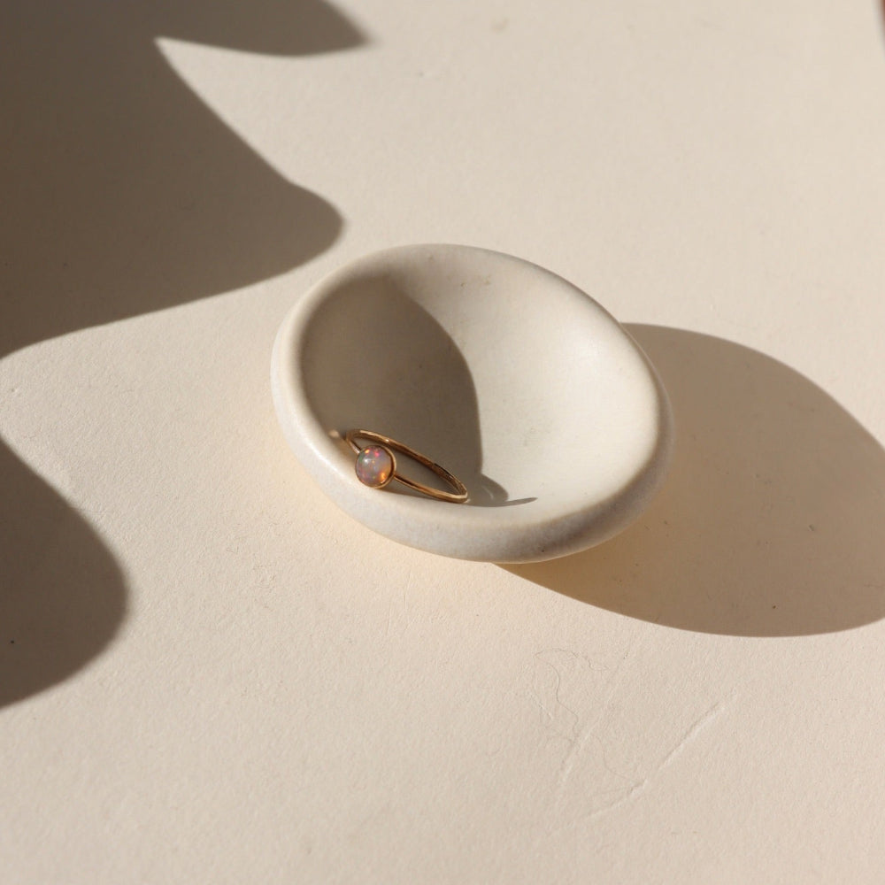 Black Opal Ring with a bezel-set 5mm stone in sterling silver or 14k gold fill, featuring flashes of green, blue, and violet