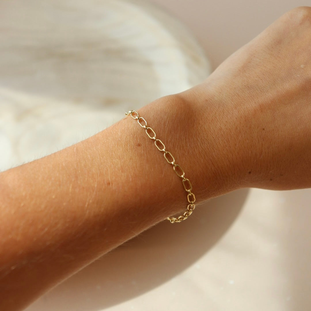 model wearing 14k gold fill chain bracelet