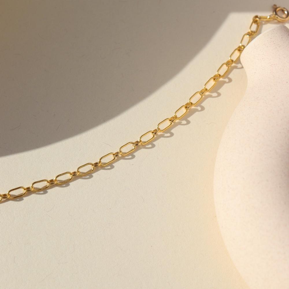 14k gold fill chain necklace on a light background
