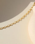 14k gold fill chain necklace on a light background
