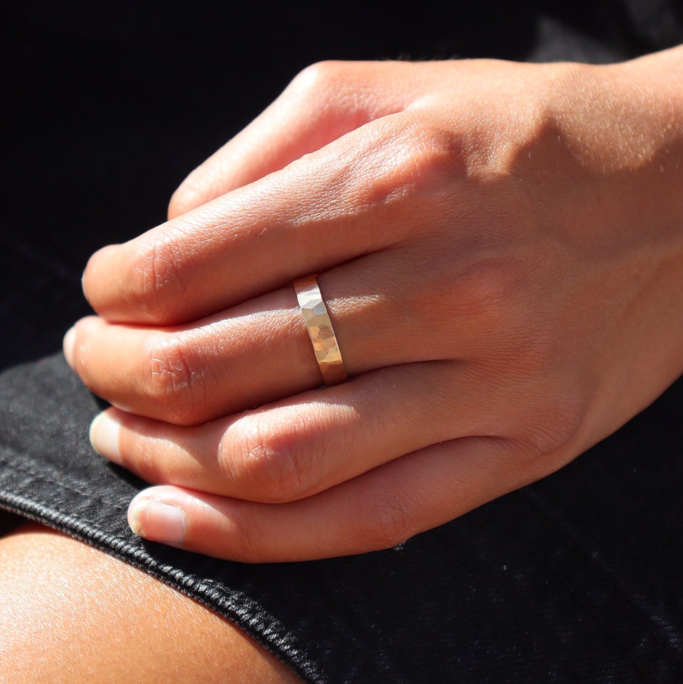 model wearing 14k gold fill hammered band ring