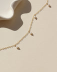 14k gold fill chain necklace with pearls on a light backgound