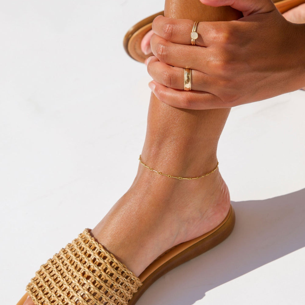 model wearing 14k gold fill bar and link anklet 