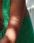 model wearing 14k gold fill wavy arm cuff 