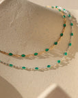 14k gold fill chain with emerald gemstones paired with sterling silver chain with emerald gemstones