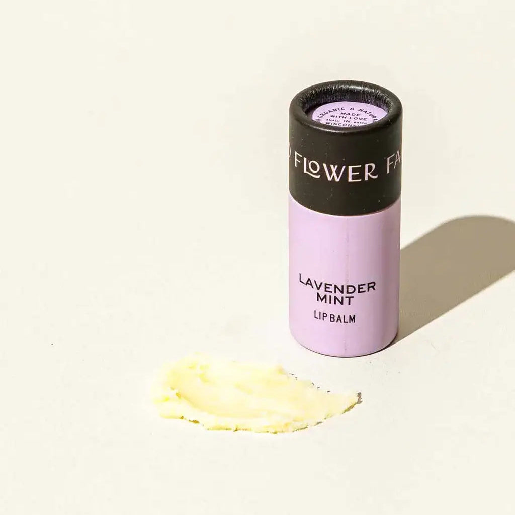 Lip balm with 'Flower Fair' branding on a light background
