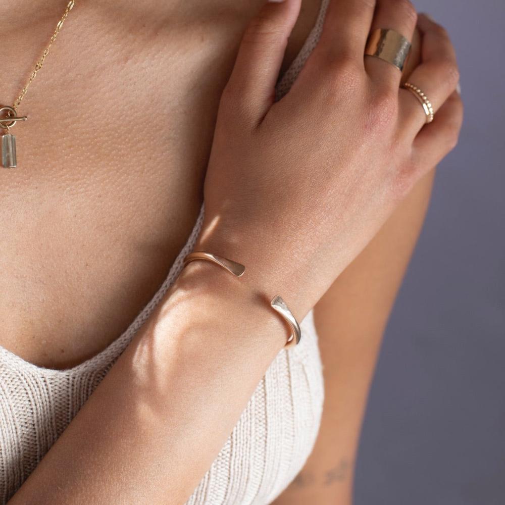 model wearing 14k gold fill hammered cuff bracelet