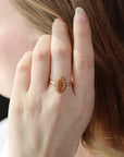 a 14k gold fill hand-set ocean jasper ring photographed on a model's hand